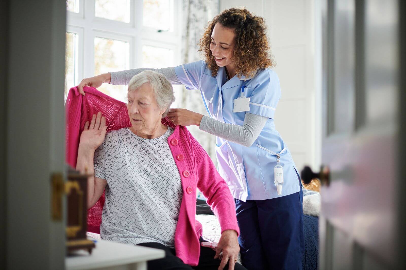 Disability support worker providing assistance with personal daily activities